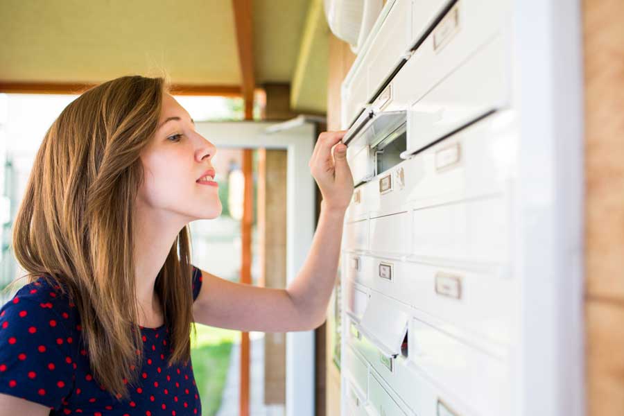 Girl looking in mailbox